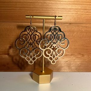 Gold dangling earrings.